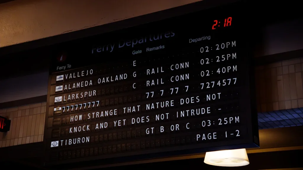 A public transport departure board showing glitched and nonsensical text instead of route information.