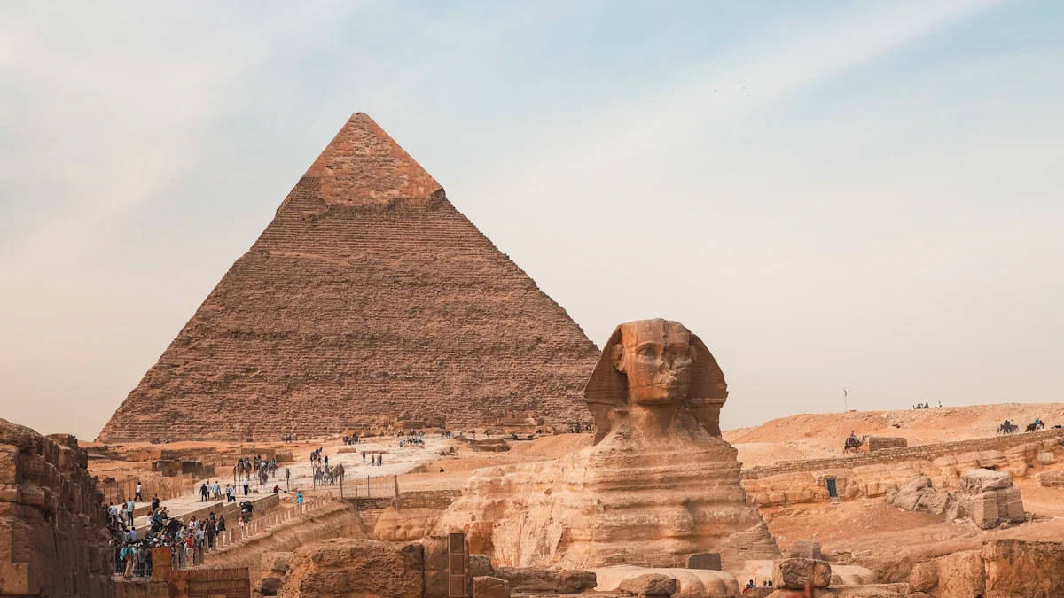 The Great Sphinx and the Great Pyramid of Giza under a clear sky.