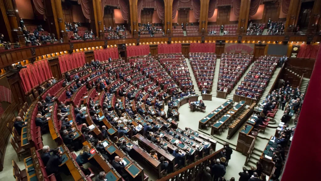 High angle view of a legislative assembly chamber filled with people sitting