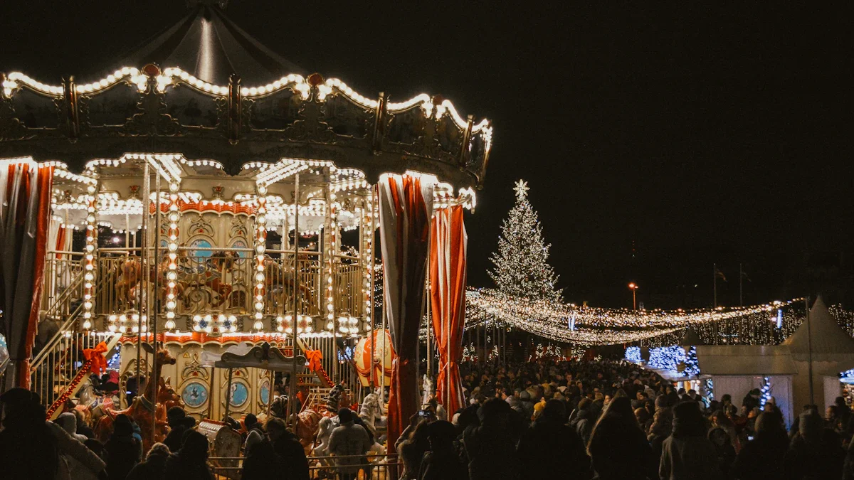 A brightly lit carousel and large Christmas tree at a night time community gathering.