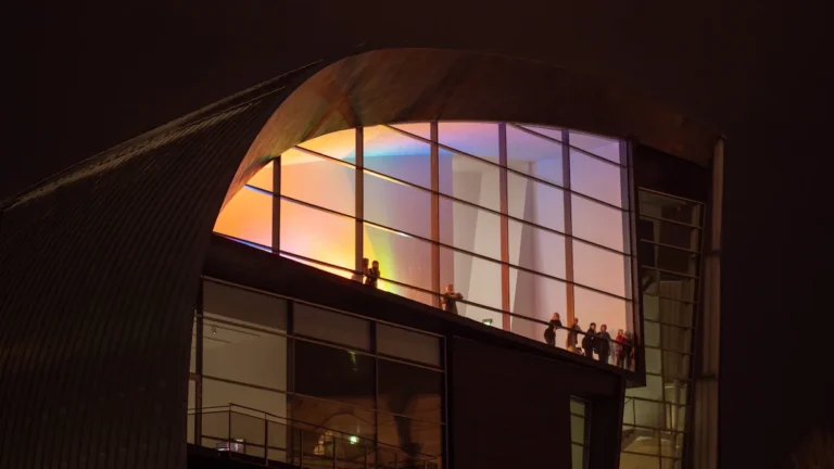 The Great Amber Concert Hall in Liepāja illuminated during a late-night cultural event.