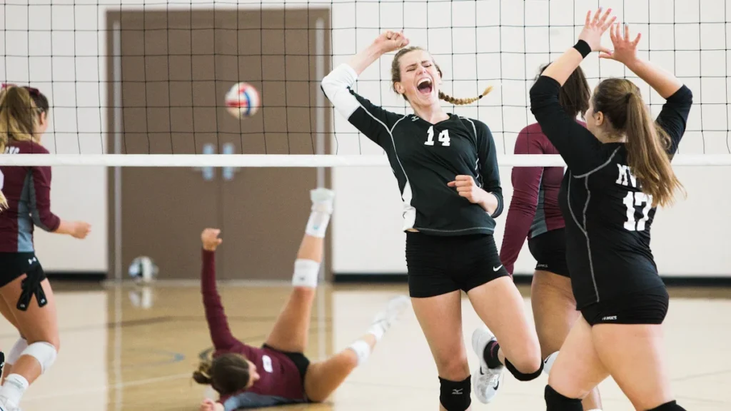 A Liepāja youth volleyball player screams in celebration during the National Finals.