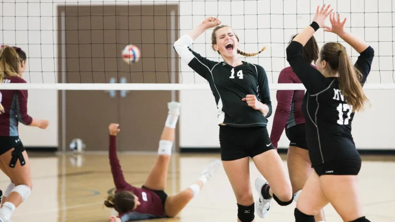 A Liepāja youth volleyball player screams in celebration during the National Finals.