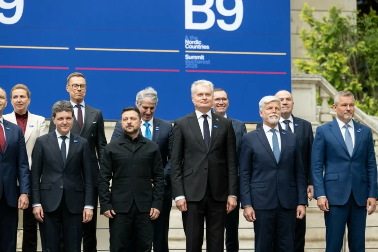 Leaders stand together in front of a large blue B9 and Nordic Countries Summit backdrop.