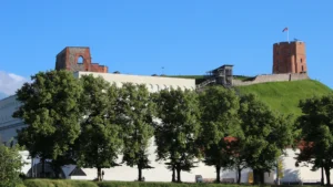 A wide shot of the historical architecture in Vilnius, Lithuania, including the Gediminas' Tower on a hill.