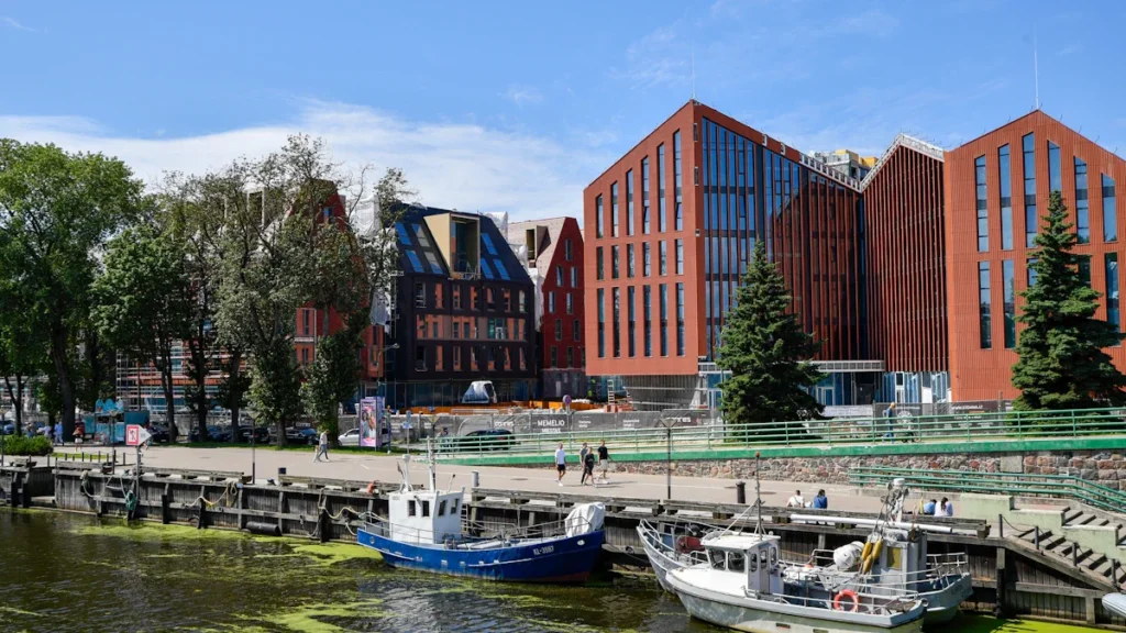 Modern architectural developments at Memelio Miestas along the Dange River in Klaipėda, Lithuania.