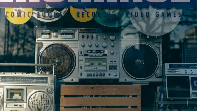A collection of vintage silver boomboxes and stereo equipment displayed together.