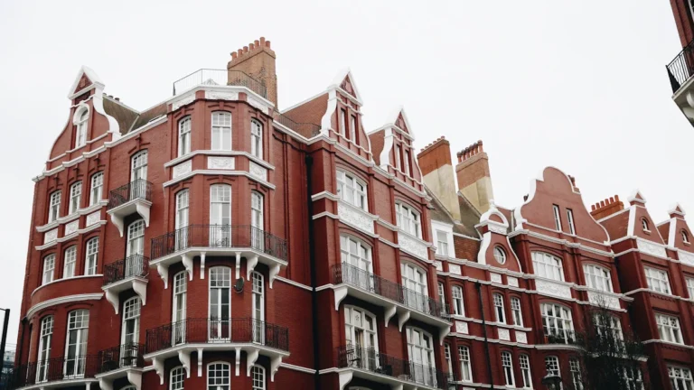 A large red brick residential building with white trim and multiple stories, representative of St Stephen’s House.