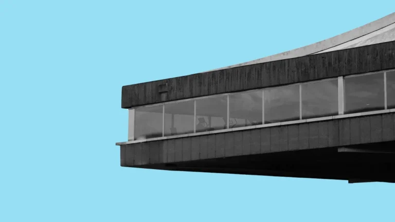 The iconic cantilevered concrete roof of the Vilnius Sports Palace, a landmark of Soviet Brutalist architecture.