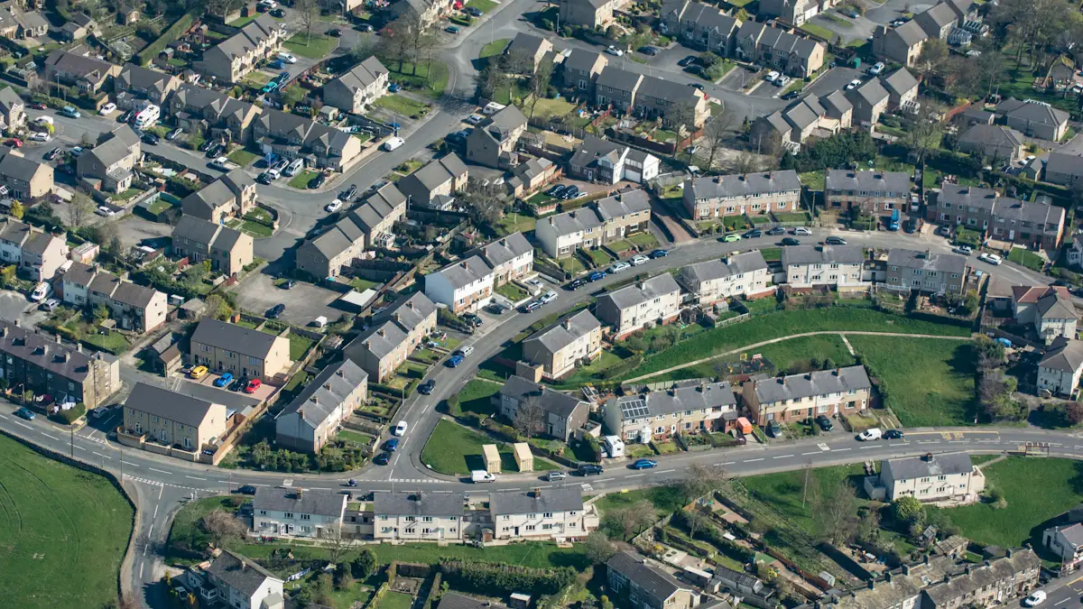 Aerial view showing a residential neighborhood in the United Kingdom with green spaces.