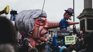 A large political puppet at a mass protest in central London.
