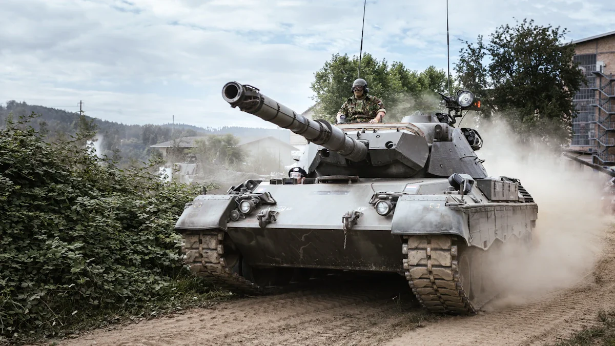 A battle tank positioned on a green grassy field during the day.