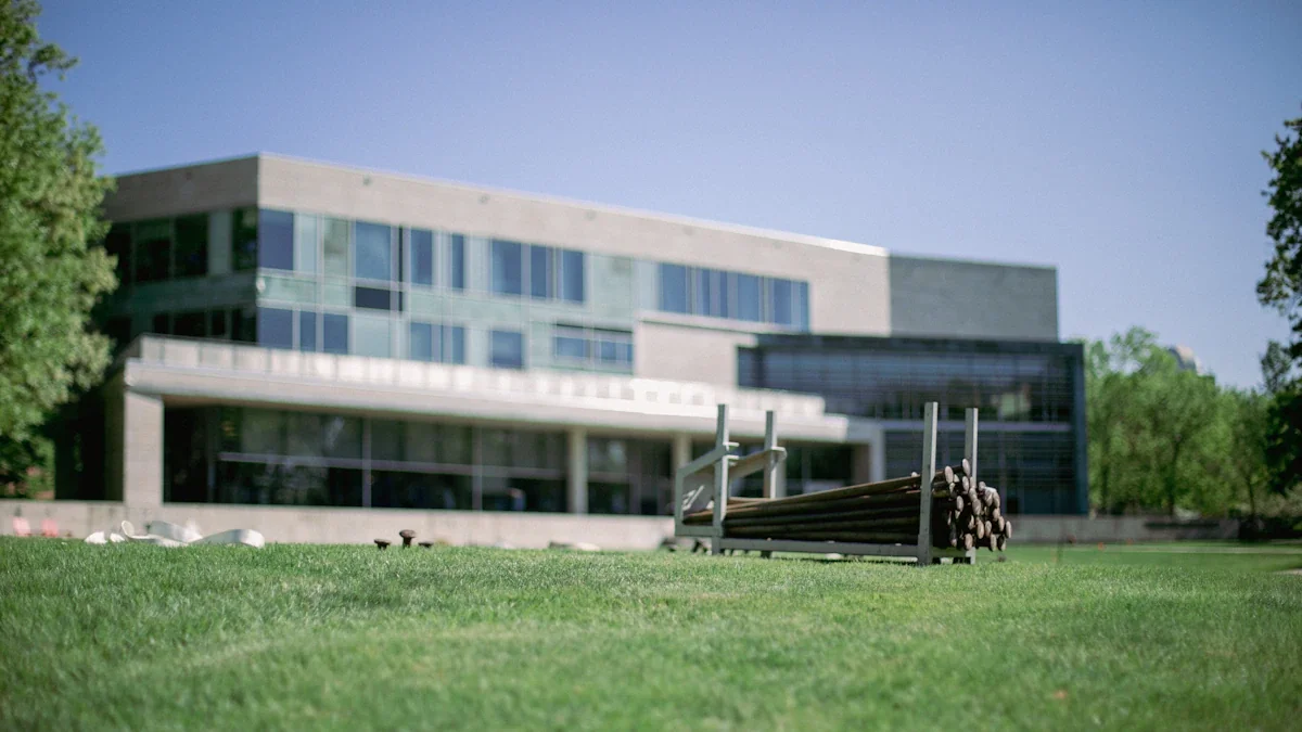 Modern university building with construction equipment on the lawn in front