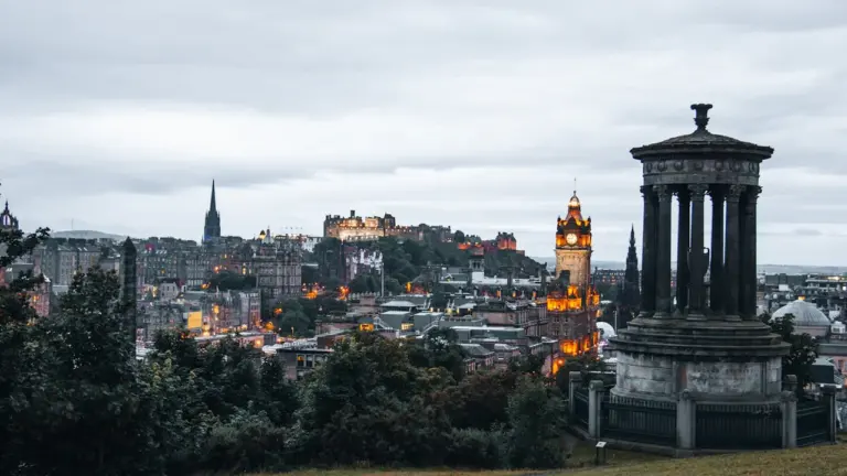 Panoramic view of Edinburgh Castle at sunset from the scenic Calton Hill.