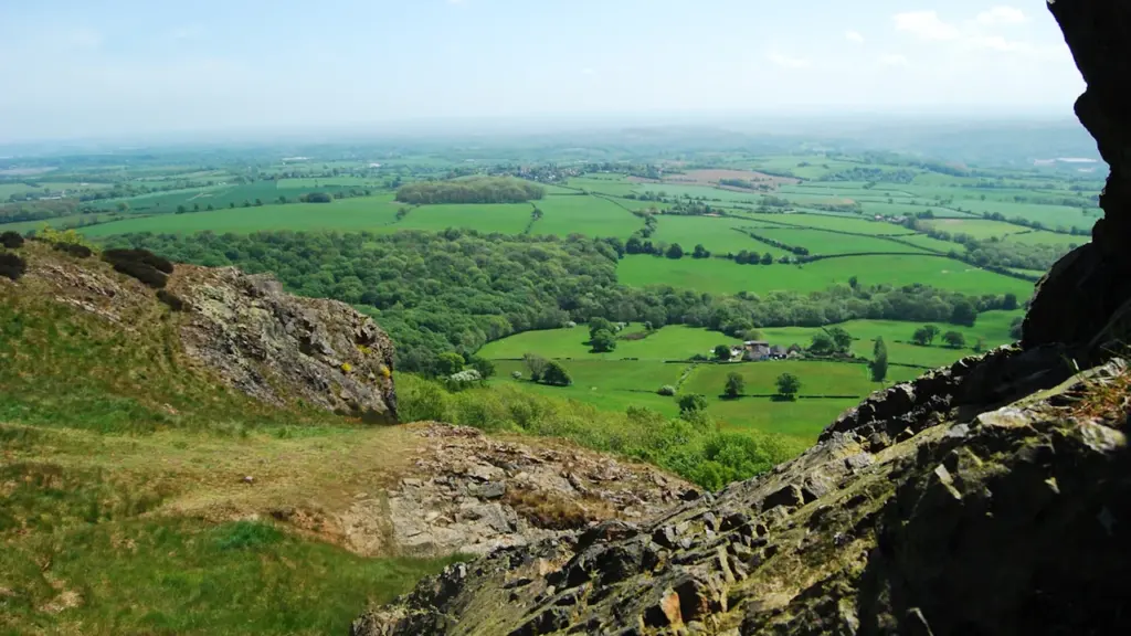 Panoramic view of the rolling Shropshire countryside from a high rocky vantage point.