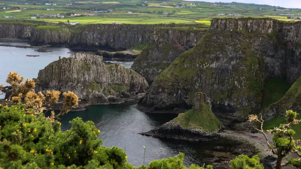 Rugged coastal cliffs and dramatic sea stacks on the Causeway Coast, Northern Ireland.